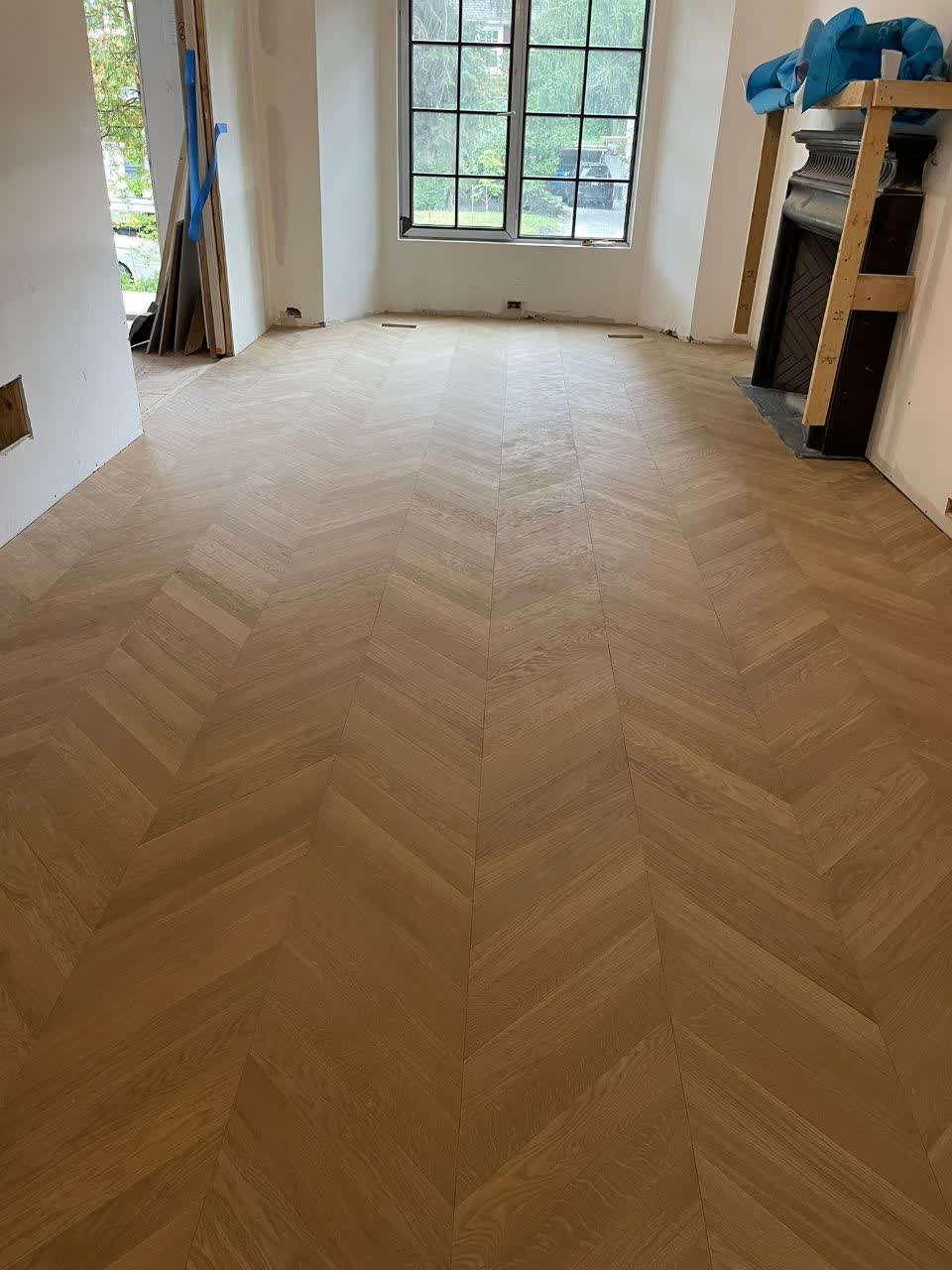 Chevron hardwood flooring in a 4-story house